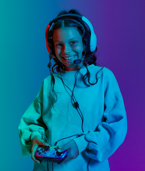 A female kid holding a controller